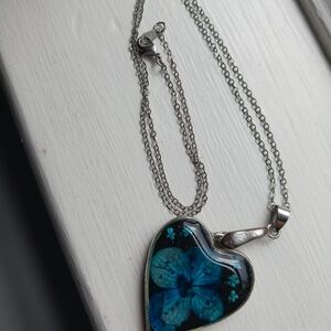 Silver Heart Pendant Necklace with Blue Floral Design